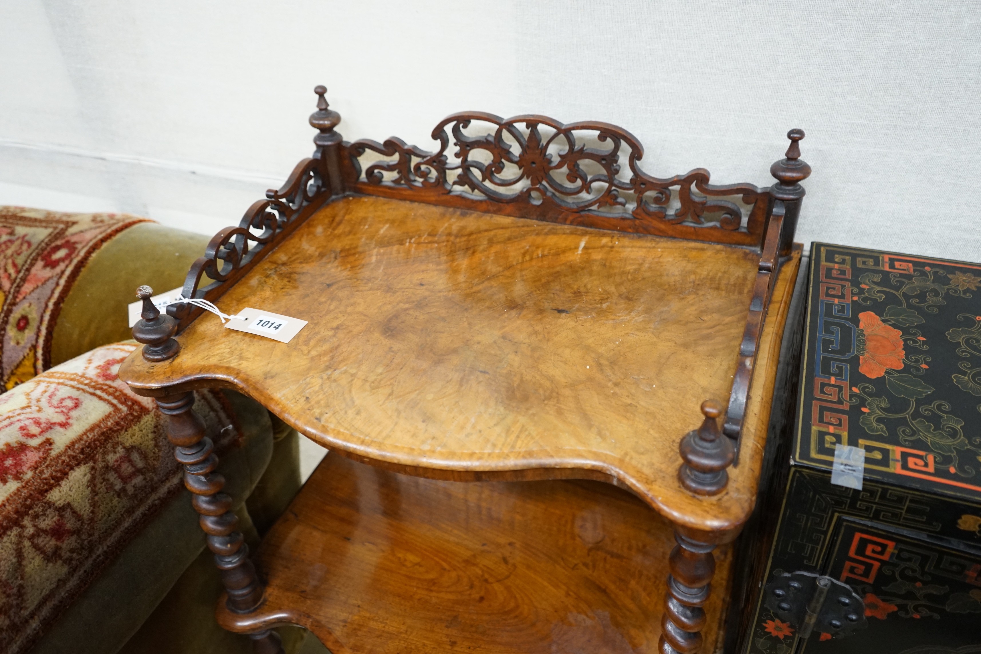 A Victorian walnut serpentine three tier whatnot, width 54cm, depth 38cm, height 104cm